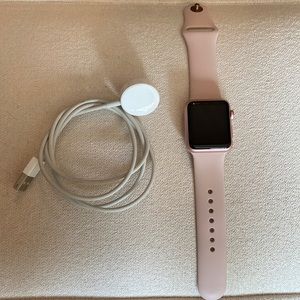 Rose gold Apple Watch series 1 with light pink band. Hardly ever used.